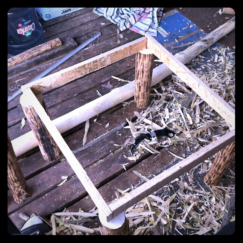 It a homemade side table all hand done and burned